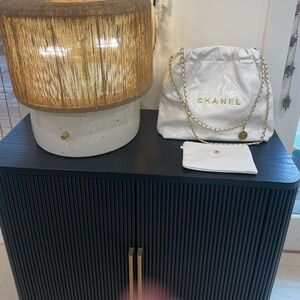 Cream Quilted Leather Drawstring Shoulder Bag with Gold Chain.